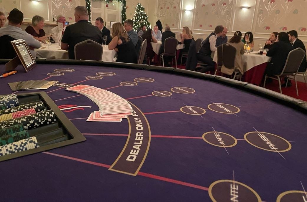 Poker table at a Christmas party with Christmas tree